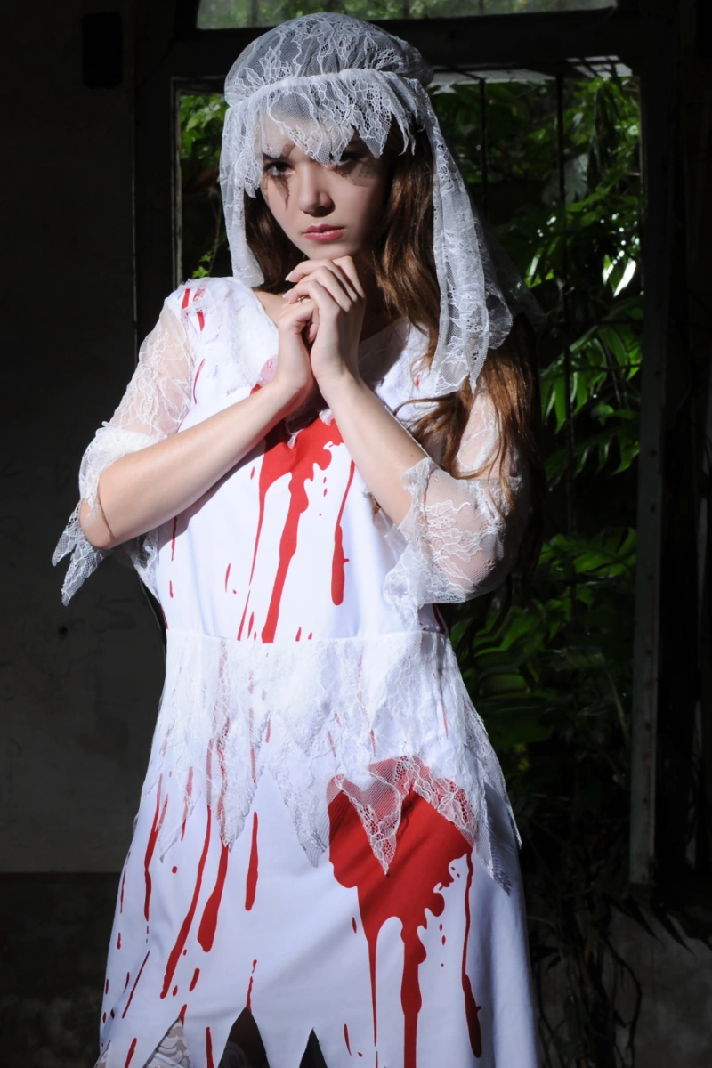 Model posing in Bloody Bride Cosplay Costume showing lace details and red blood effects on dress