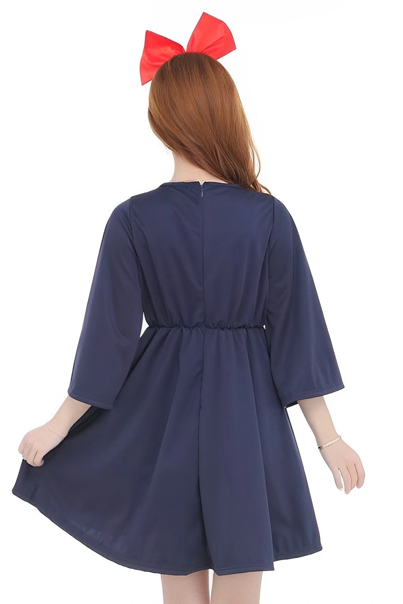Model wearing a navy school girl costume with wide sleeves and a red bow headband