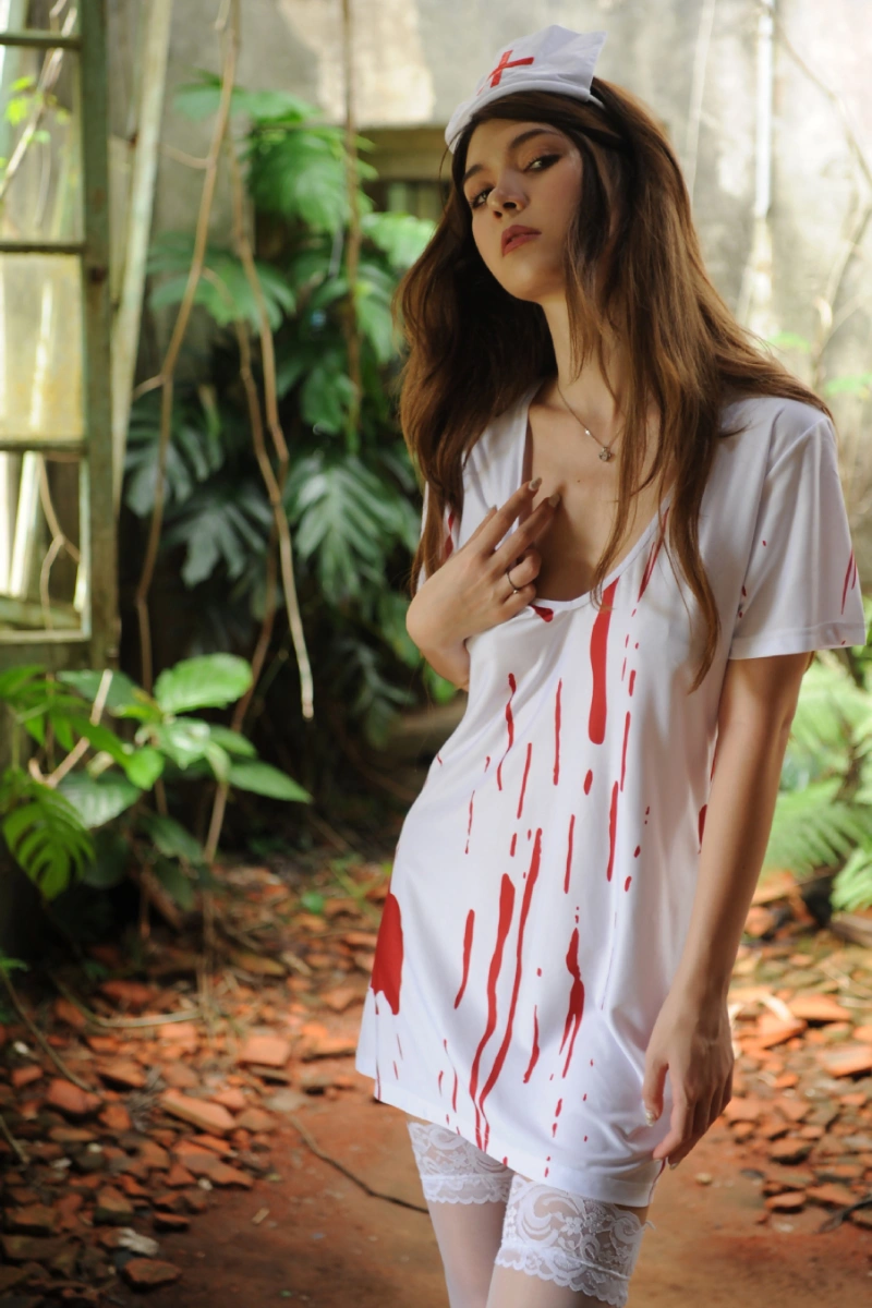 Sexy bloody nurse costume with short white dress featuring red blood splatter, paired with lace thigh-high stockings.