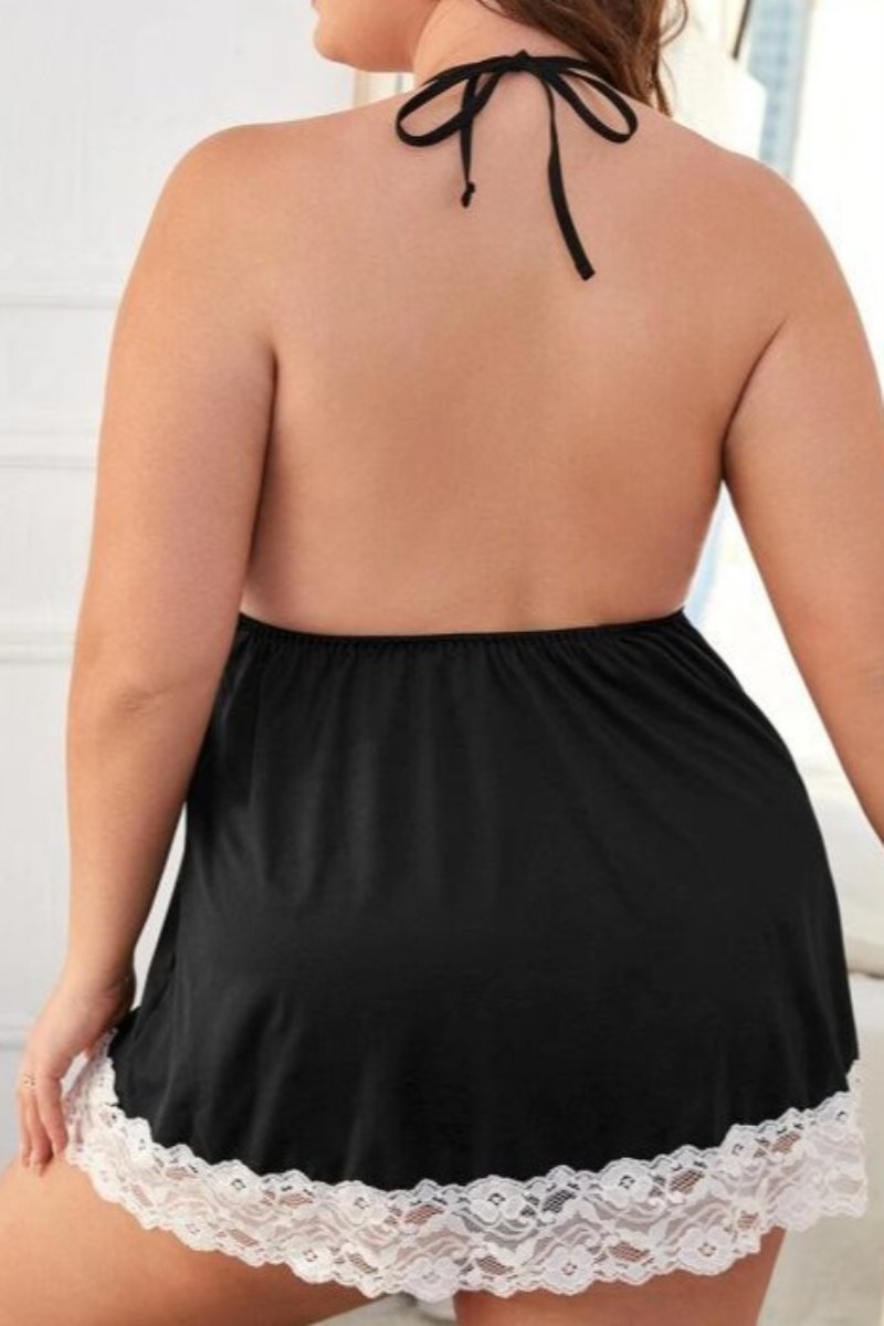 Plus-size woman wearing wholesale black lace pajamas with deep V-neck and white lace detailing