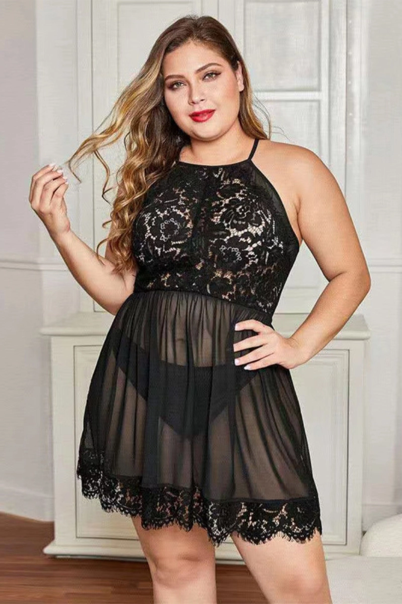 Curvy woman wearing black wholesale lace pajamas with halter neckline and sheer skirt