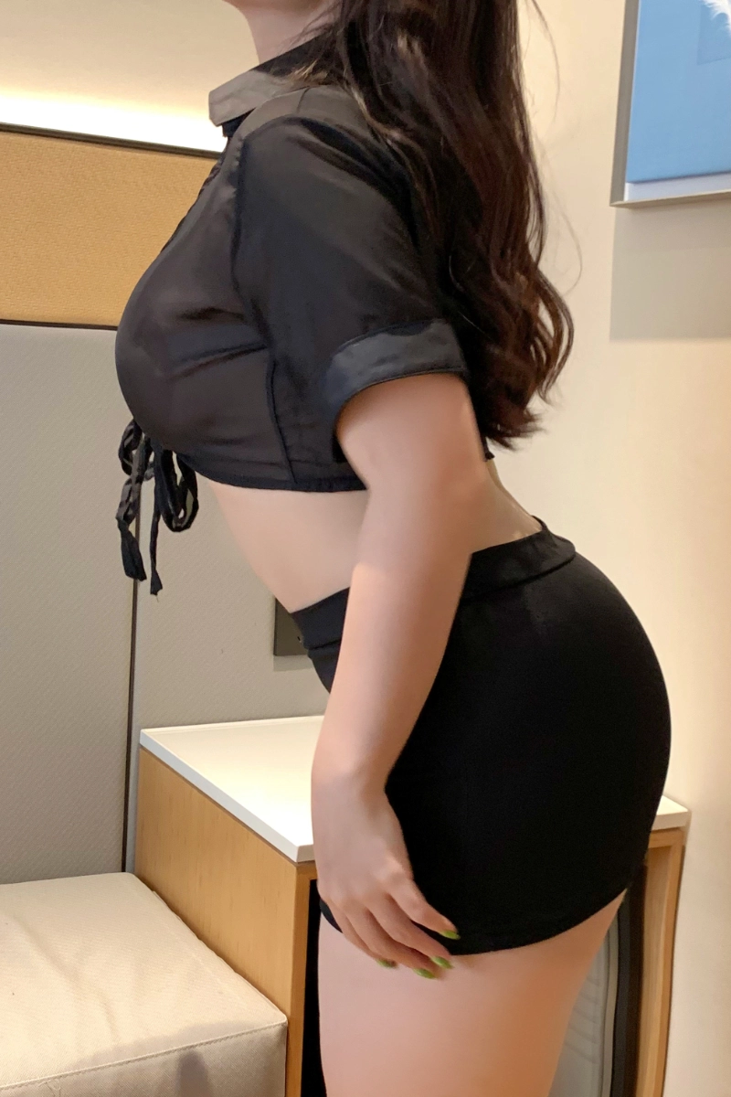 Alt: Bulk long lace pajamas in black with sheer tied top and figure-hugging skirt