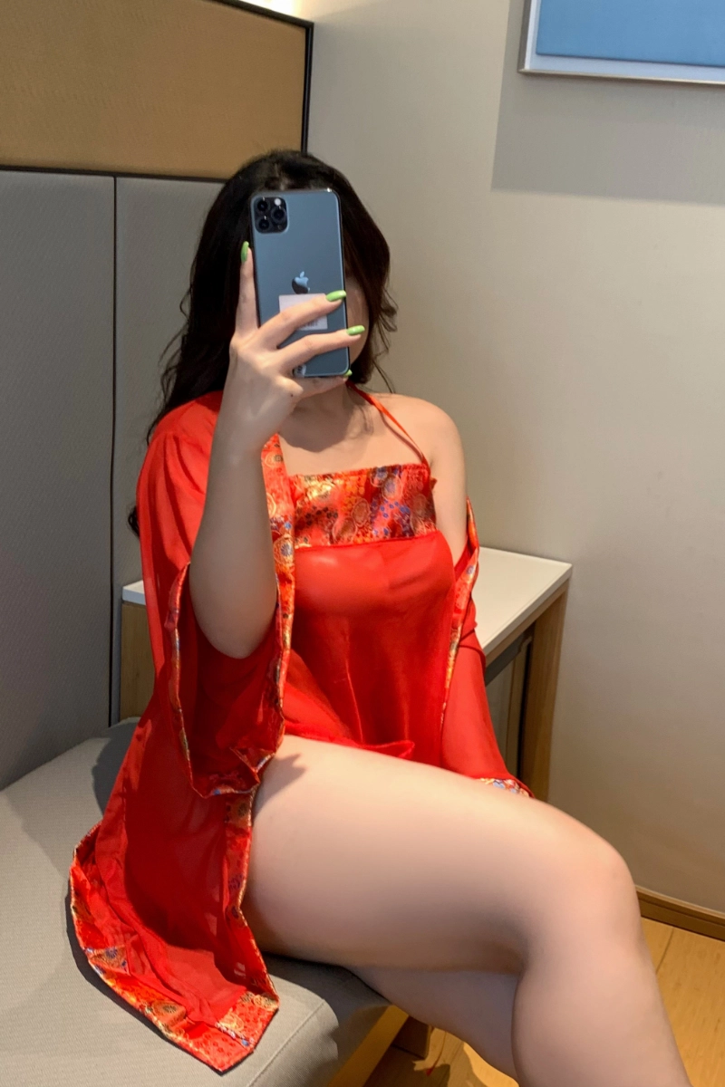 Model in red b2b sheer Lace Pajamas sitting on chair