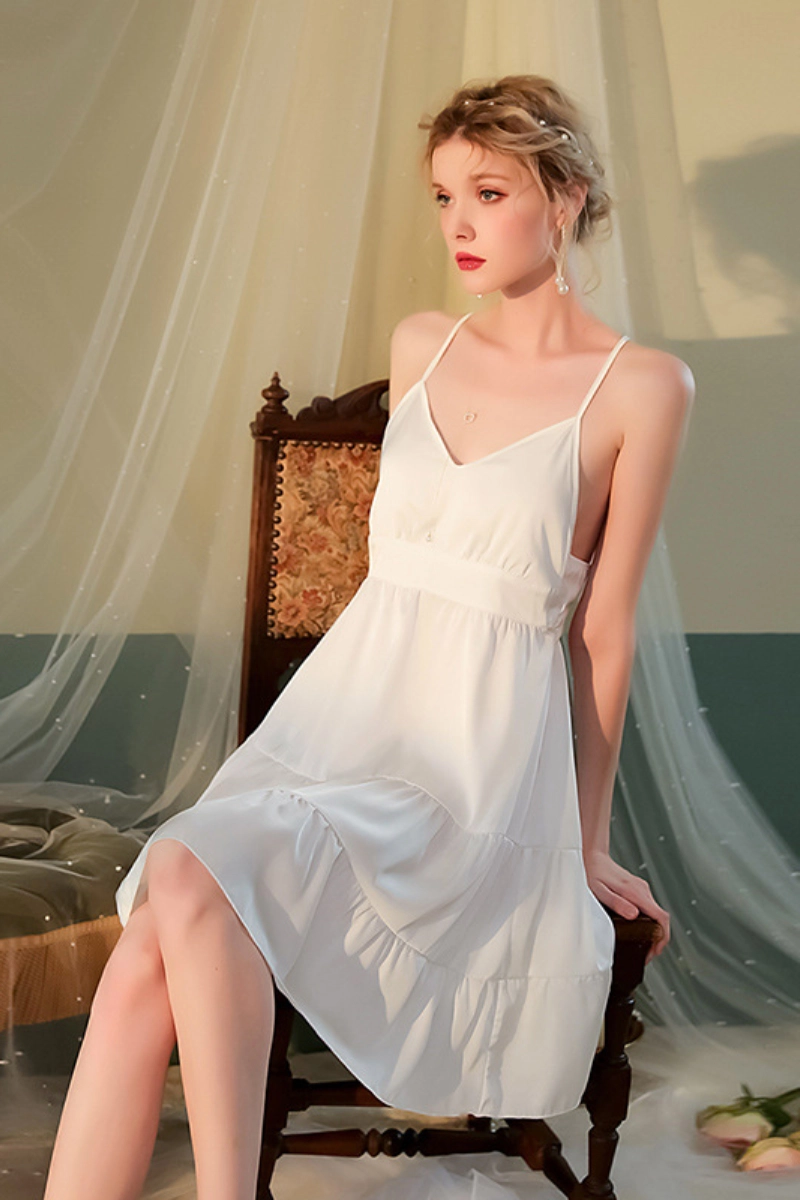 Woman wearing elegant white oem Lace Pajamas with spaghetti straps