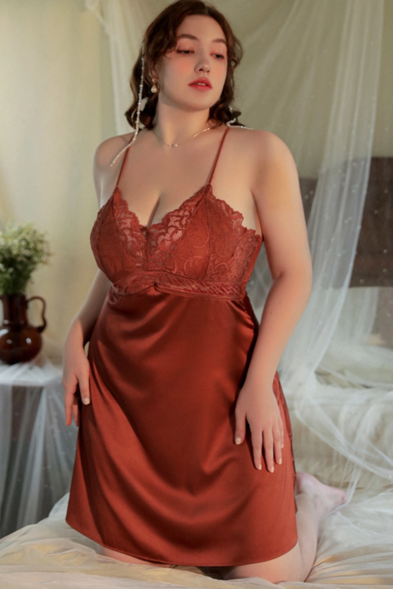 Woman in rust red private label sheer lace pajamas with plunging neckline