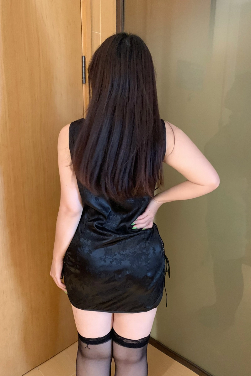 Alt: Woman showcasing back design of b2b lace chemise Pajamas