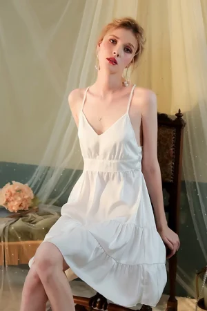 Woman in soft white oem Lace Pajamas with feminine tiered skirt