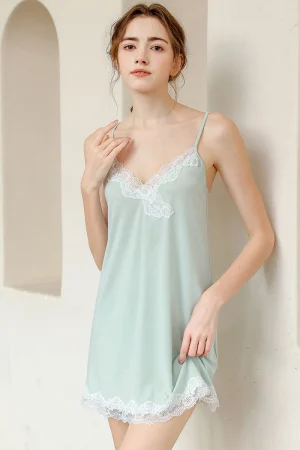 Model wearing bulk linen lace pajamas with white lace V-neck