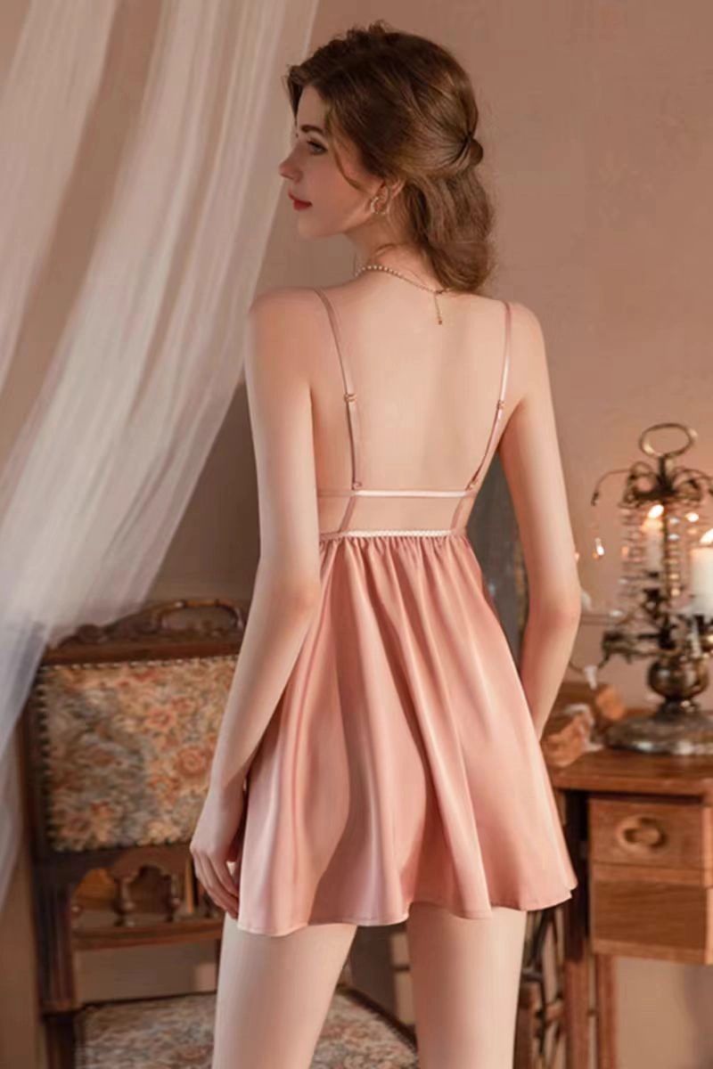 Alt:Model wearing elegant pink bulk knee length lace Pajamas with open back