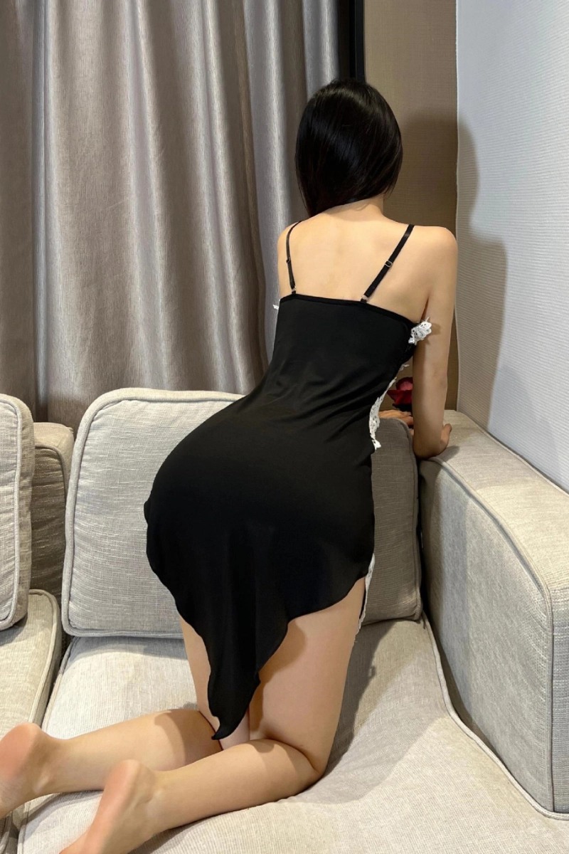Back view of wholesale transparent lace pajamas in a modern setting