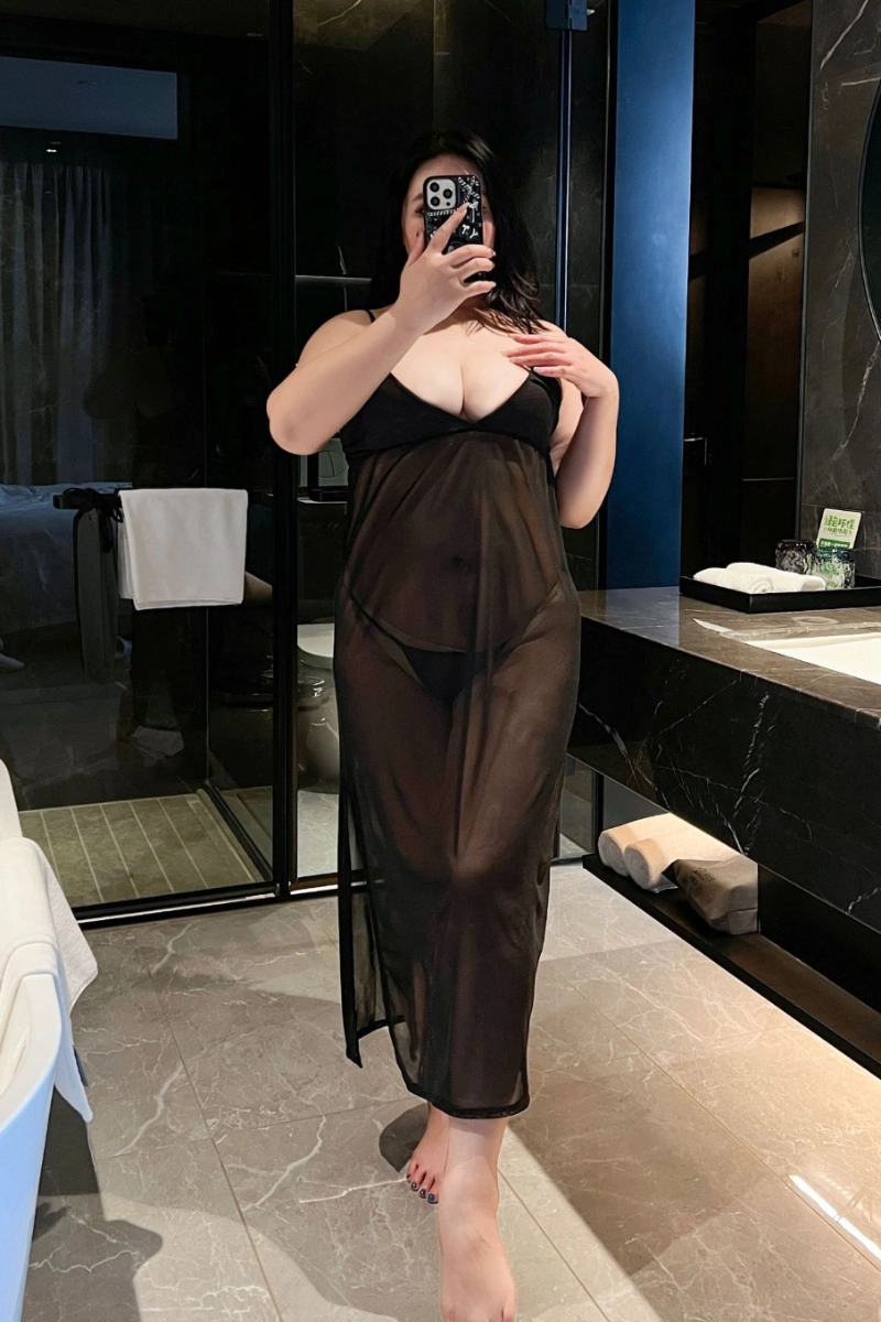 Alt text:Full body view of model wearing thin lace Pajamas in long black transparent fabric