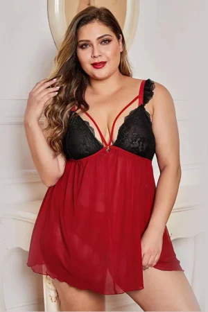 Plus size model in red and black b2b lace holiday pajamas standing confidently