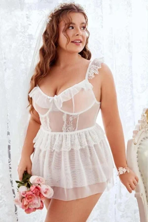 Plus size woman in white lace transparent pajamas with floral headpiece
