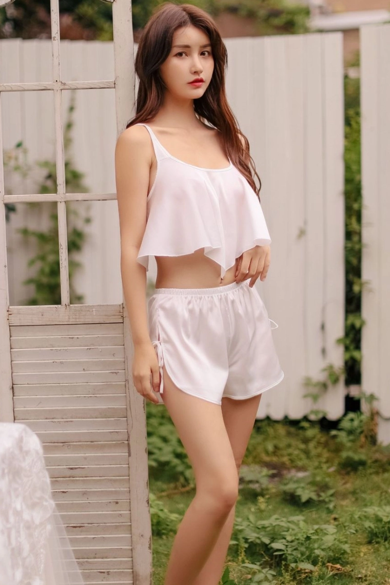 Alt Text:Lightweight white lace up pajamas with elastic waist shorts