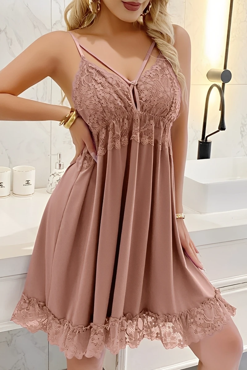 Model wearing dusty pink wholesale lace satin Pajamas featuring a satin flare skirt and intricate lace neckline.