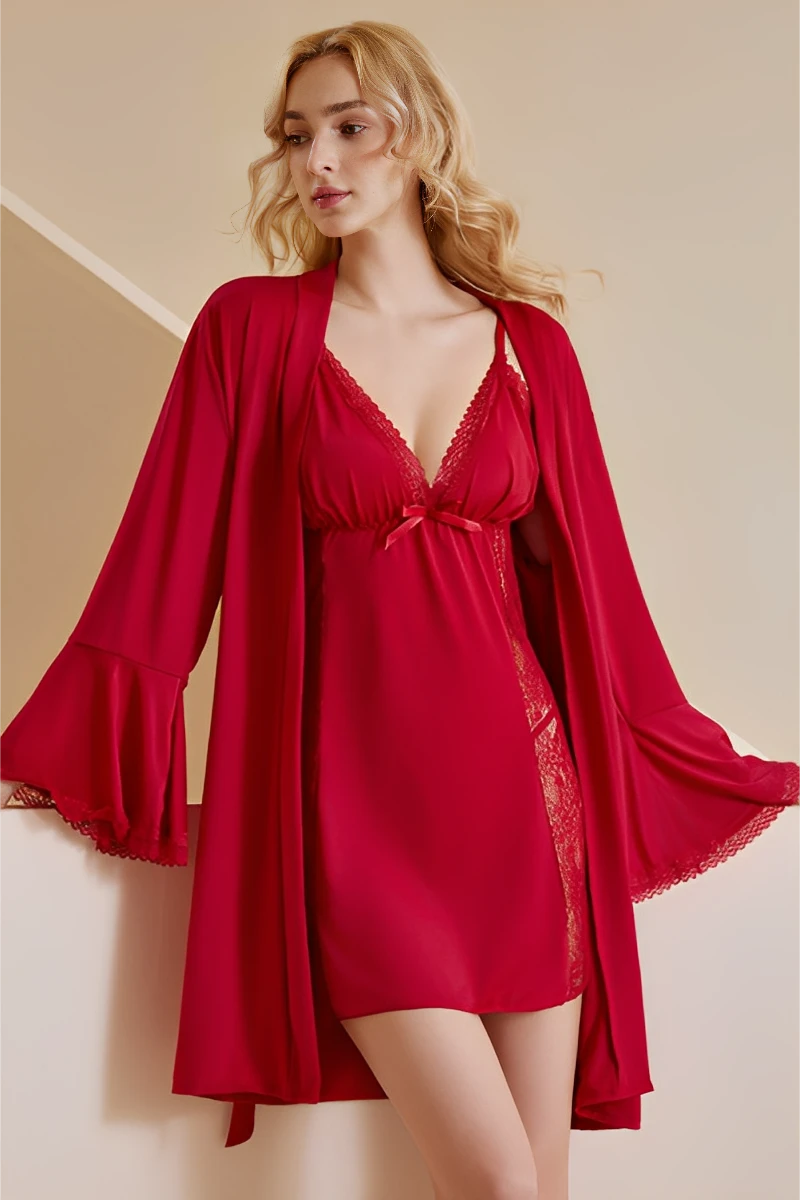 Elegant woman wearing a burgundy Sexy Bridal Nightgown with flared-sleeve robe and lace trim.