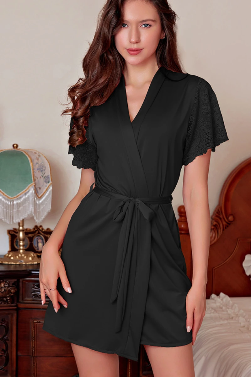 Model wearing a black Strappy Sexy Nightgown robe set with lace short sleeves and a waist tie.