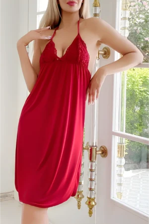 Model wearing a red b2b lace trim satin pajama set with halter neck design and smooth satin finish for wholesale lingerie supply