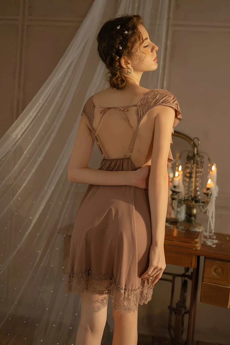 The back view of a khaki wholesale cute lace pajama set showing the open-back design with adjustable straps and delicate bow detailing.