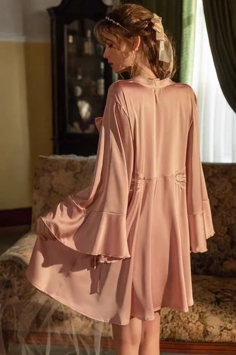 Back view of pink satin robe with flared sleeves, styled as a b2b sexy nightgown for women