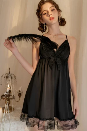 Model wearing black lace sexy pajamas featuring butterfly lace embroidery, sheer babydoll silhouette, and lace hem for an elegant lingerie look