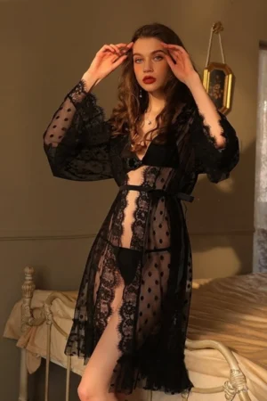 Model wearing a black sheer lace robe with polka dot mesh sleeves and waist belt, presented as a wholesale fashion sexy nightgown women style