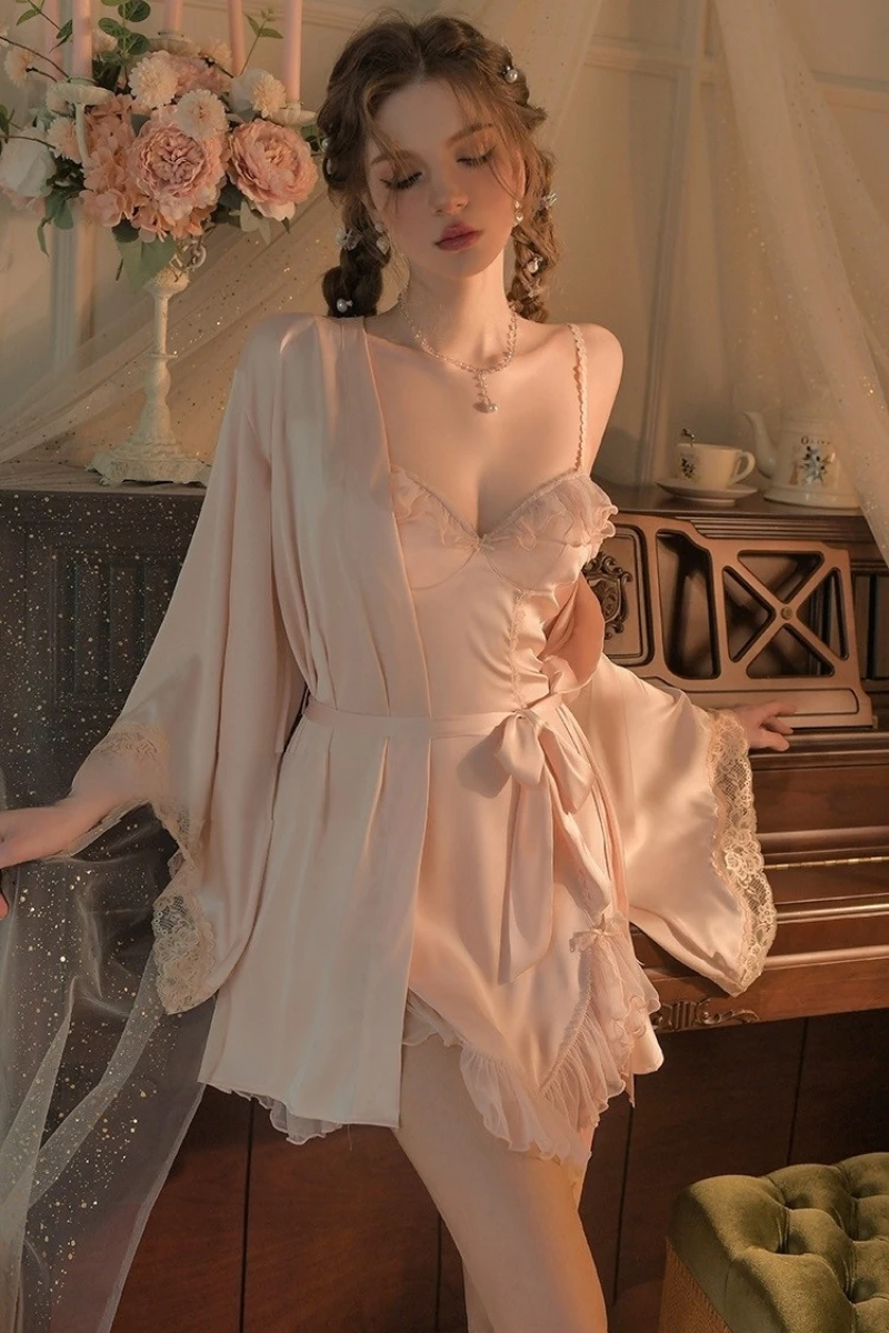 Model in blush pink satin slip nightdress with lace accents and robe, styled as a b2b sexy chic nightgown