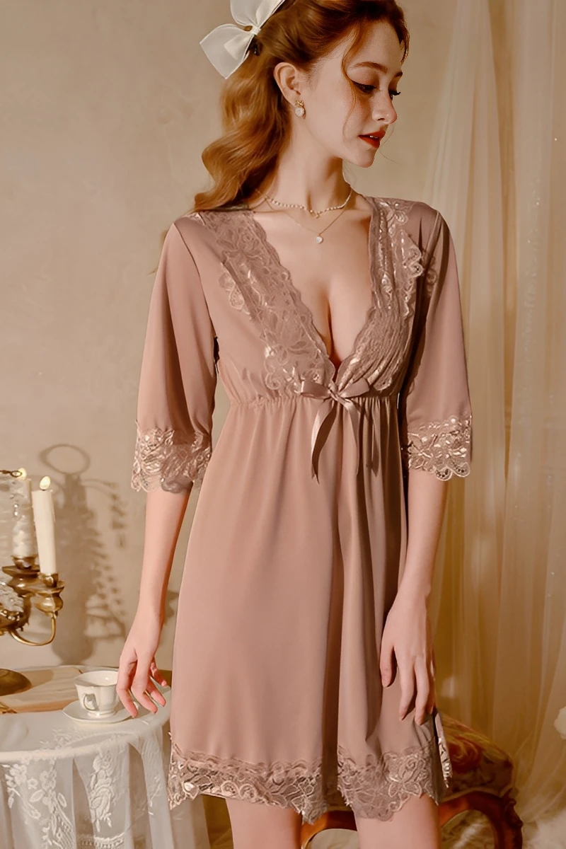 Model wearing a taupe bulk lace pajama with lace V-neckline, half sleeves, and soft flowing hem
