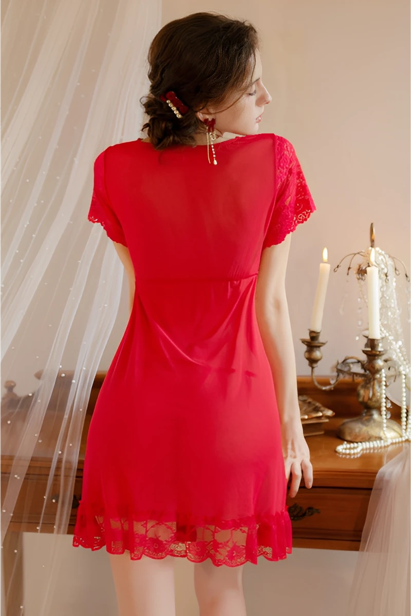 Back view of a red bulk lace pajama top showing sheer fabric, lace hem, and relaxed fit for wholesale lingerie buyers