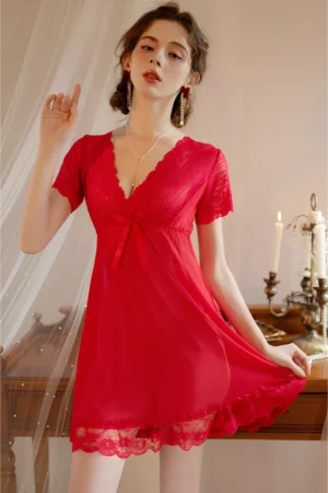 Model wearing a red bulk lace pajama top with V-neck lace trim, sheer fabric, and short sleeves for sexy nightwear styling