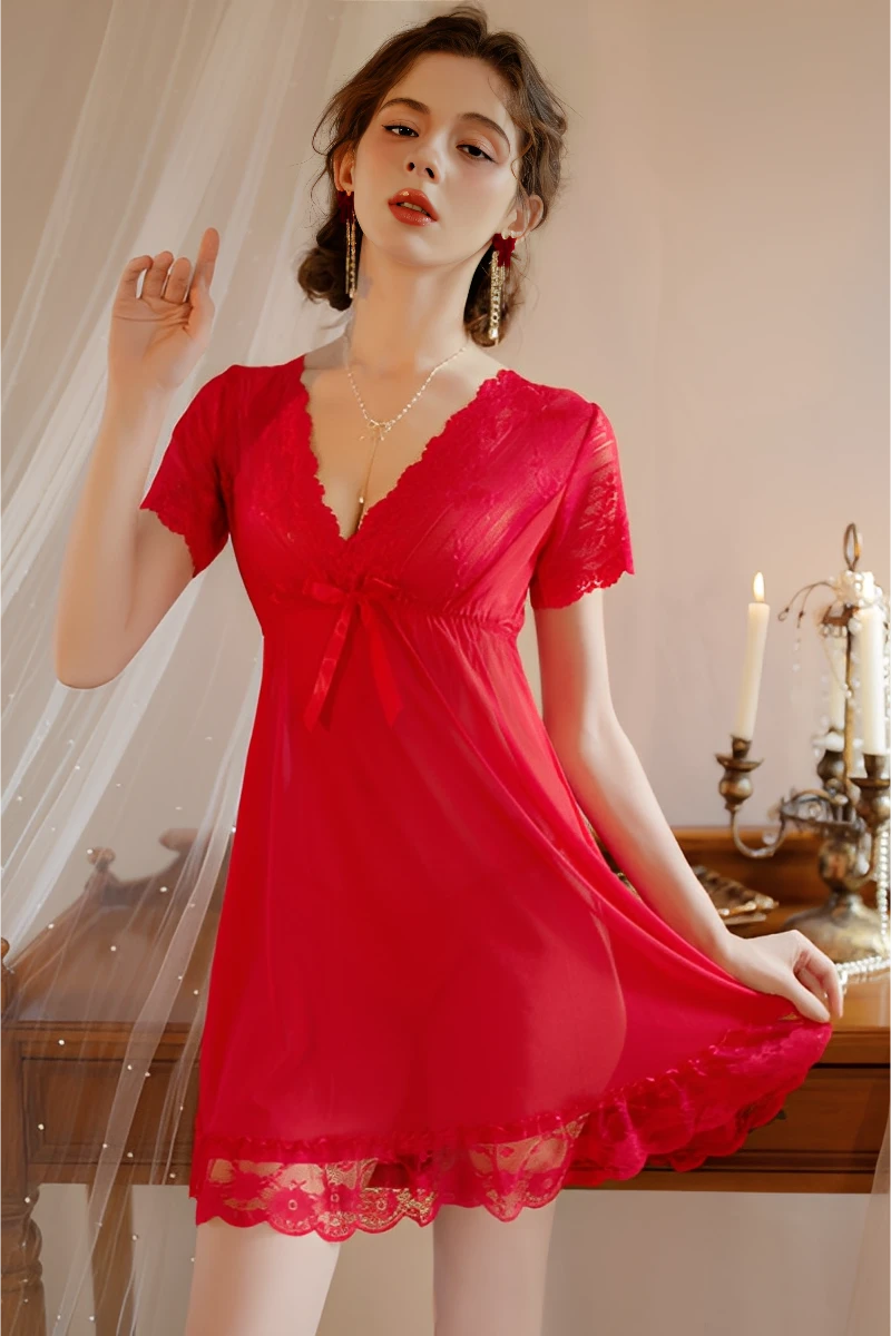 Model wearing a red bulk lace pajama top with V-neck lace trim, sheer fabric, and short sleeves for sexy nightwear styling