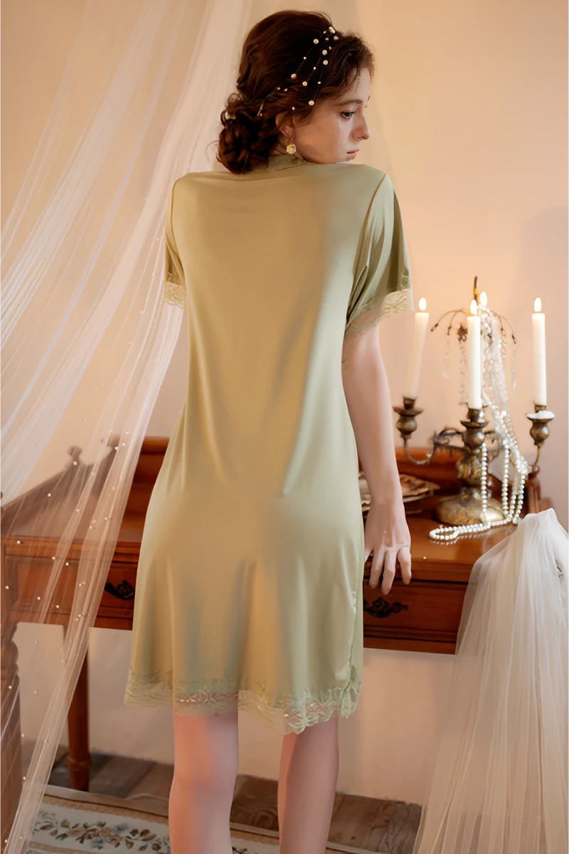 Back view of a green short-sleeve nightdress highlighting smooth fabric and bulk pajama lace production quality