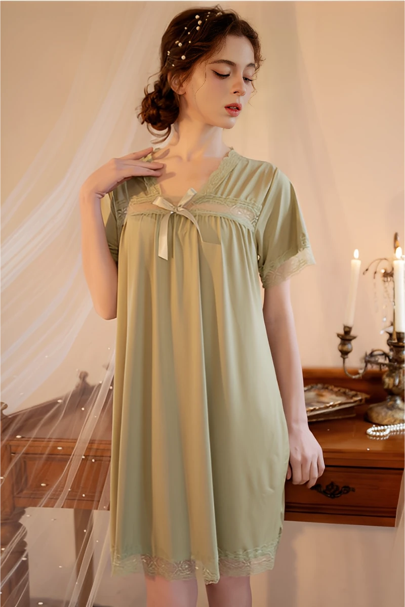 Model wearing a soft green nightdress featuring delicate trim, designed for bulk pajama lace wholesale collections