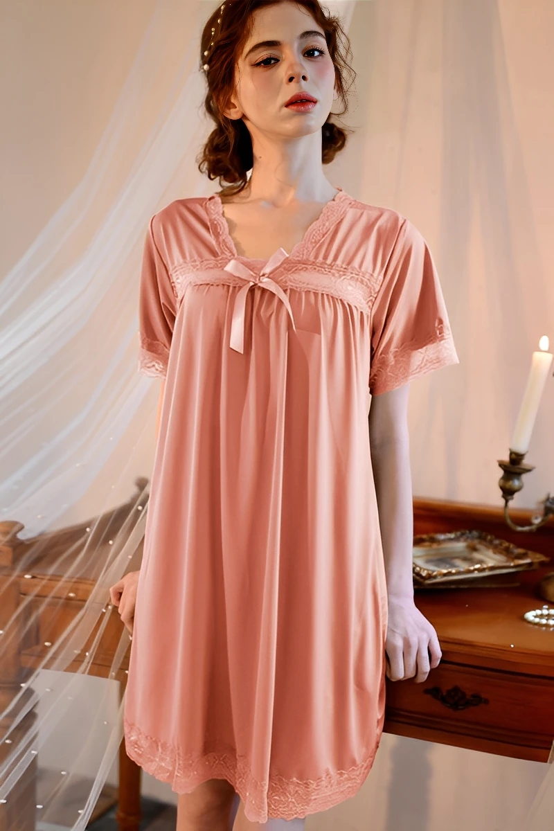Pink short-sleeve nightdress displayed as part of a bulk pajama lace wholesale lineup