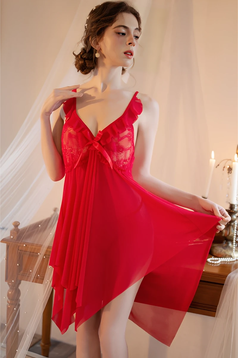 Model wearing a red bulk silk lace pajama set featuring sheer fabric, lace bodice, and lightweight flowing design for sexy nightwear collections.