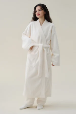 White cotton sexy nightgown with long sleeves, front pockets, and adjustable waist tie for relaxed nightwear use