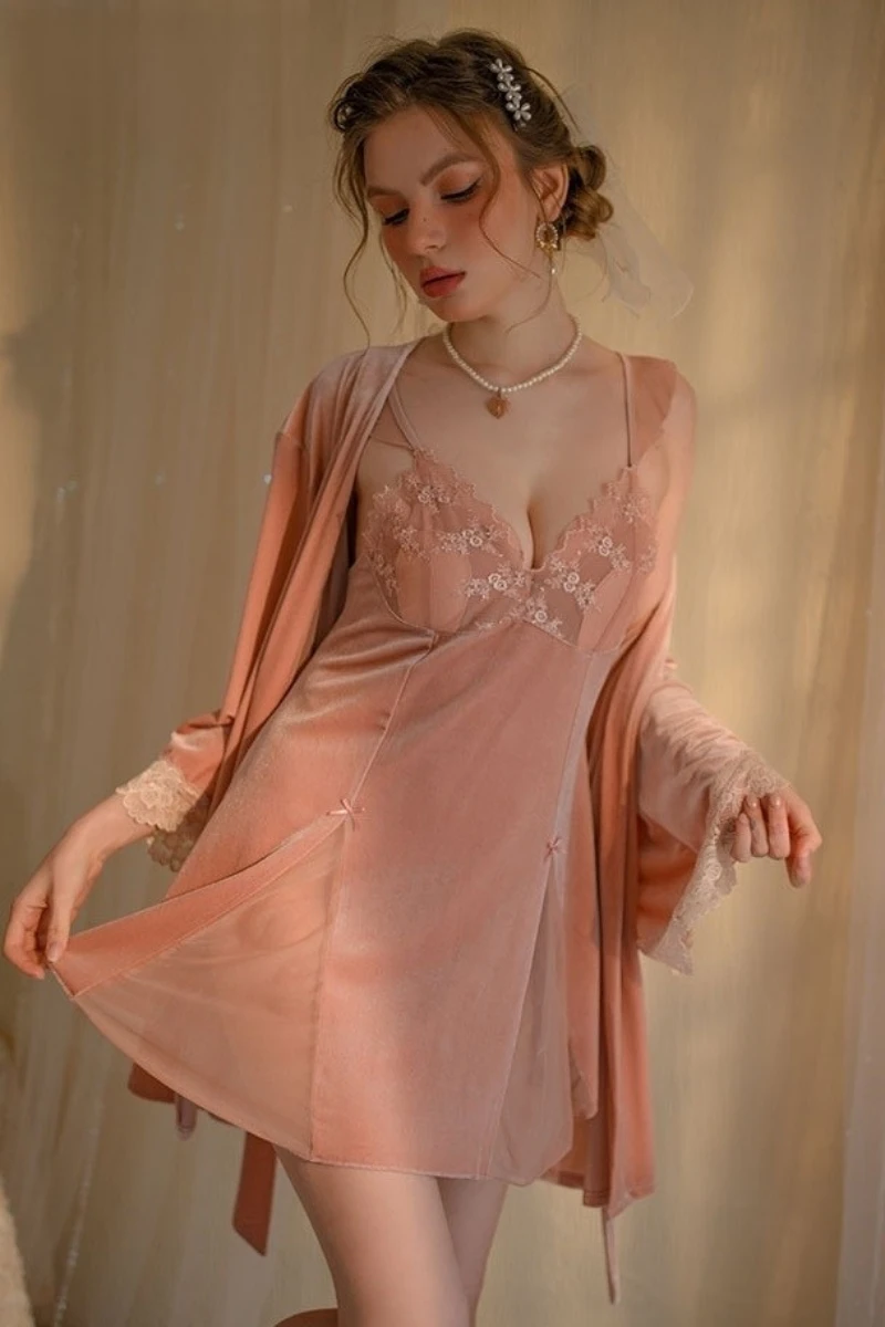 Model wearing custom long sexy nightgowns in blush pink with sheer lace bodice, soft flowing skirt, and matching lightweight robe.
