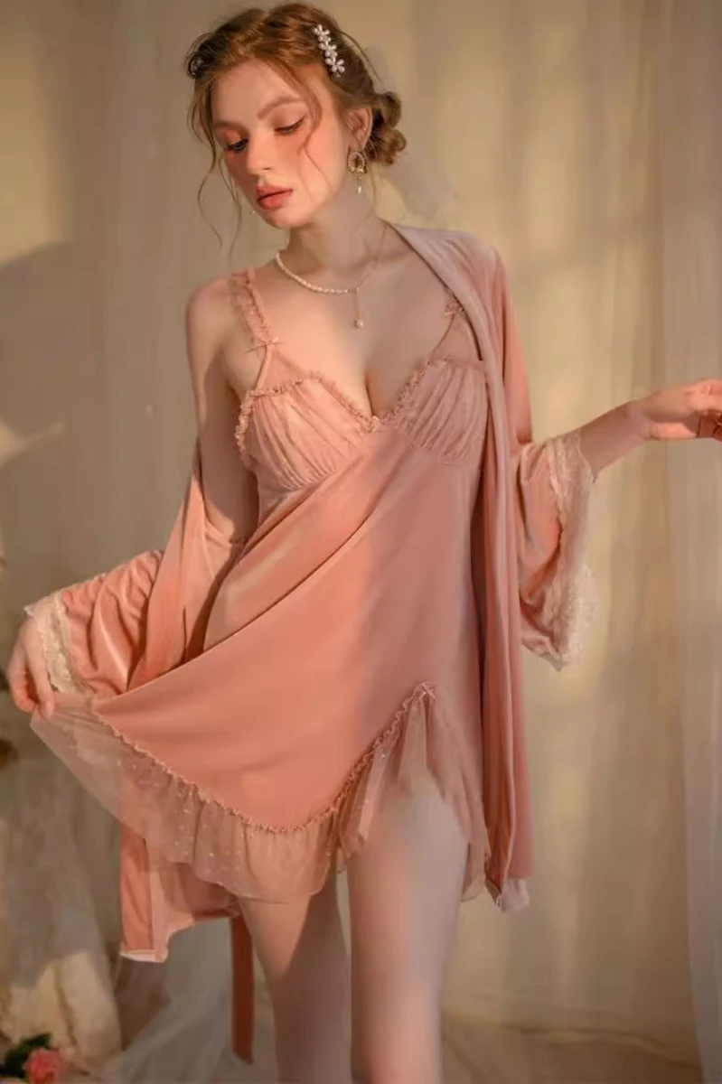Model wearing peach satin custom nightgown sexy with lace-trimmed slip, soft drape, and coordinated robe