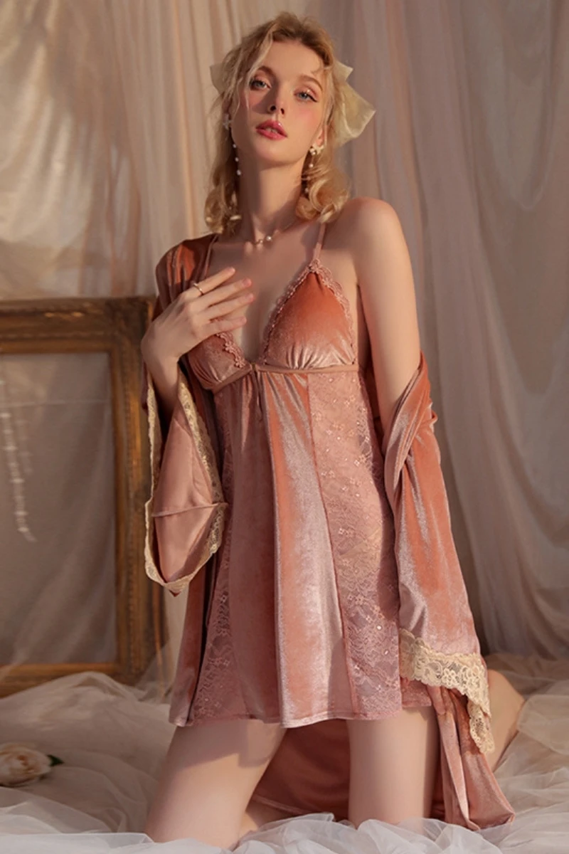 Model wearing custom sexy long nightgowns in blush pink satin with lace details and a flowing robe set