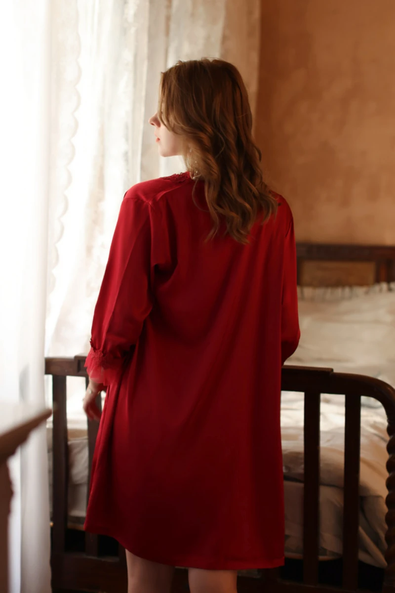 Rear view of custom sexy silk nightgown in deep red with flowing fabric and minimalist silhouette for women’s nightwear