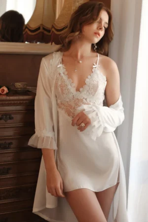 Model wearing a custom sexy silk nightgown in white with sheer lace bodice, delicate straps, and lightweight robe for elegant nightwear presentation