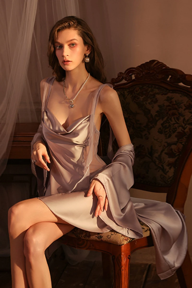 Custom women sexy nightgowns in lavender silk, featuring a fitted bodice, sheer side accents, and a flowing short hem.