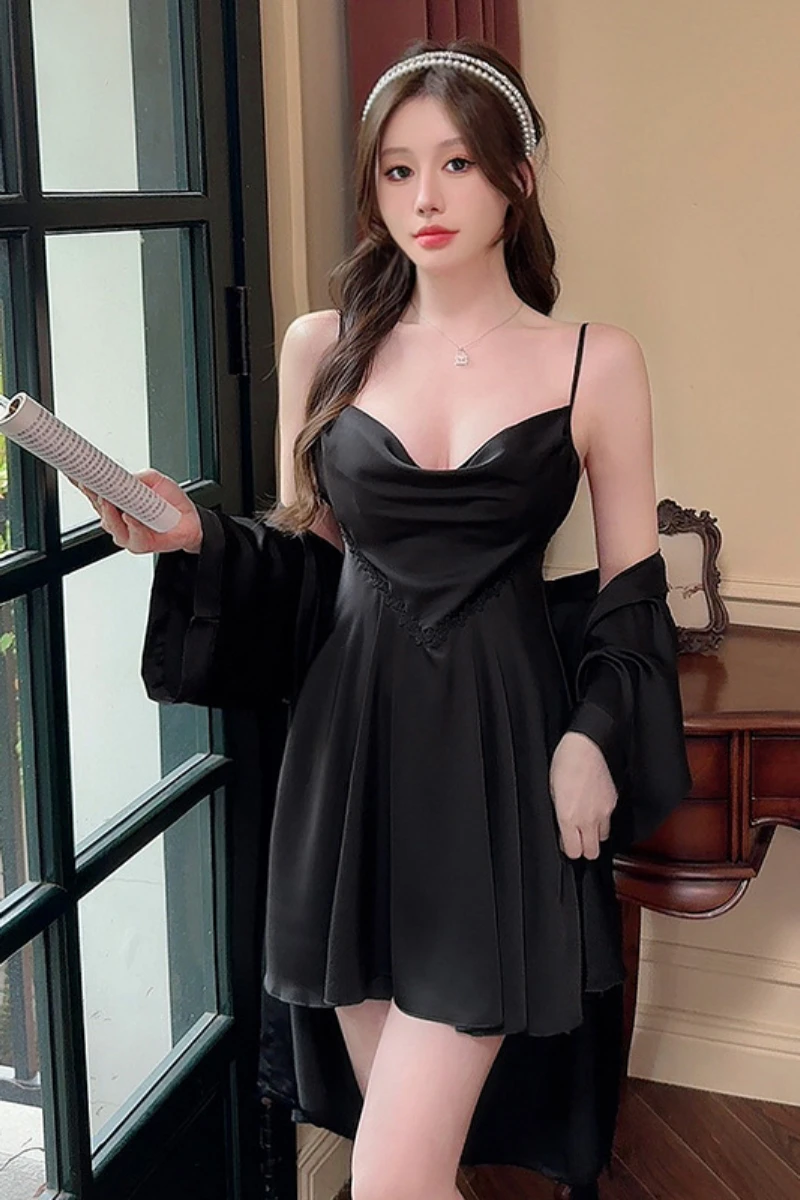Black custom womens sexy nightgown with smooth satin texture, slim shoulder straps, and flowing hemline styled in an indoor bedroom scene