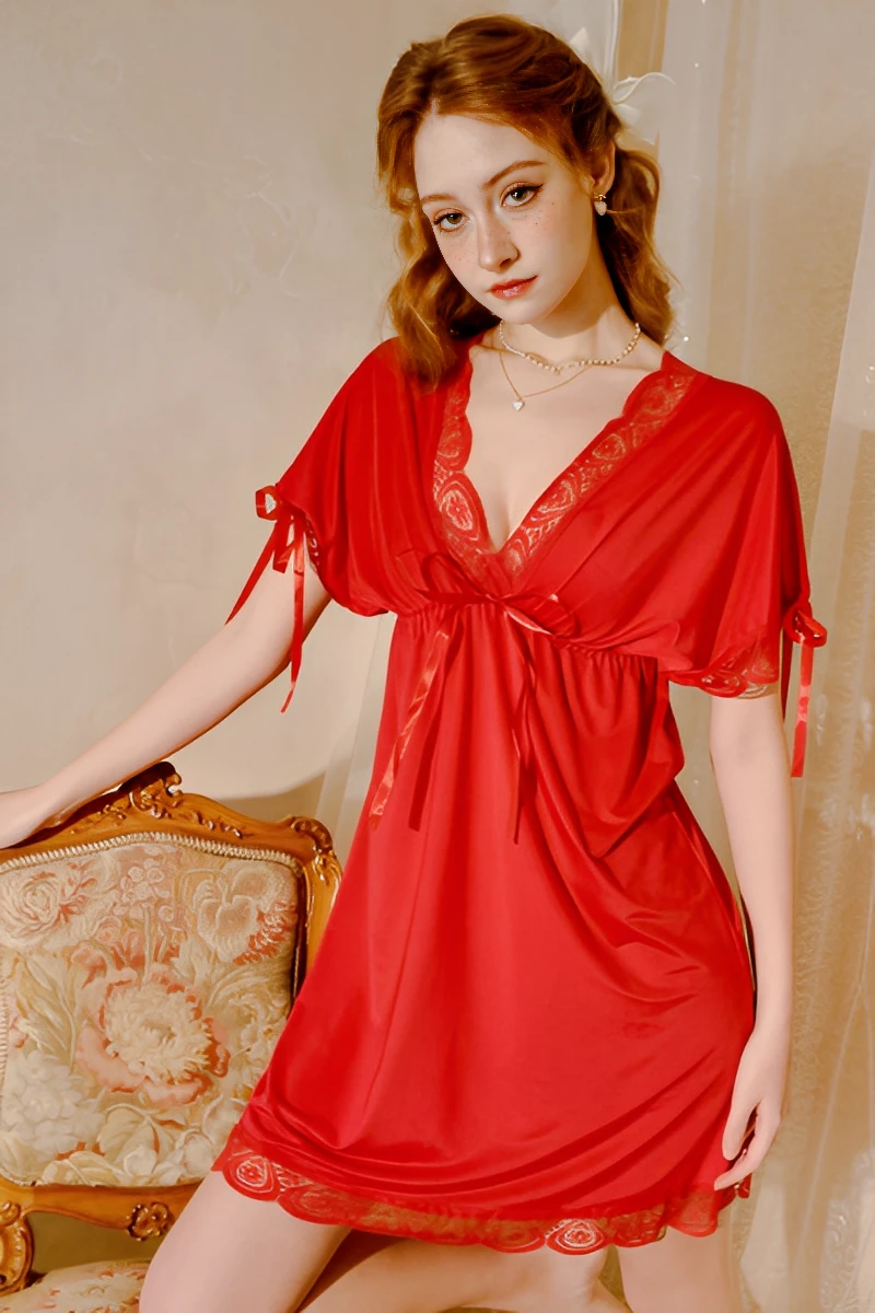 Model wearing a red lace pajama set with v-neck lace trim, short sleeves, and a soft flowing silhouette for women’s sleepwear collections.