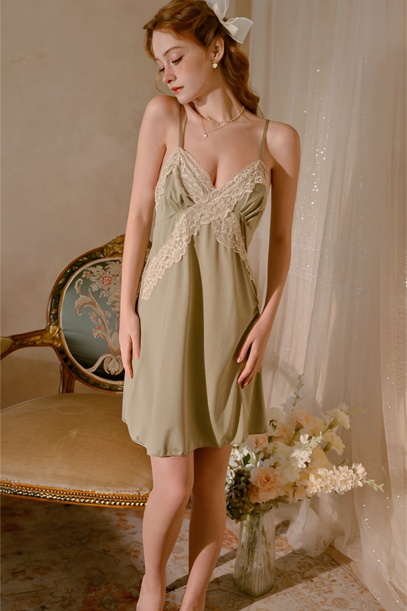 Model wearing a lace trim pajama set featuring a soft satin nightdress with delicate lace crossover design and adjustable straps