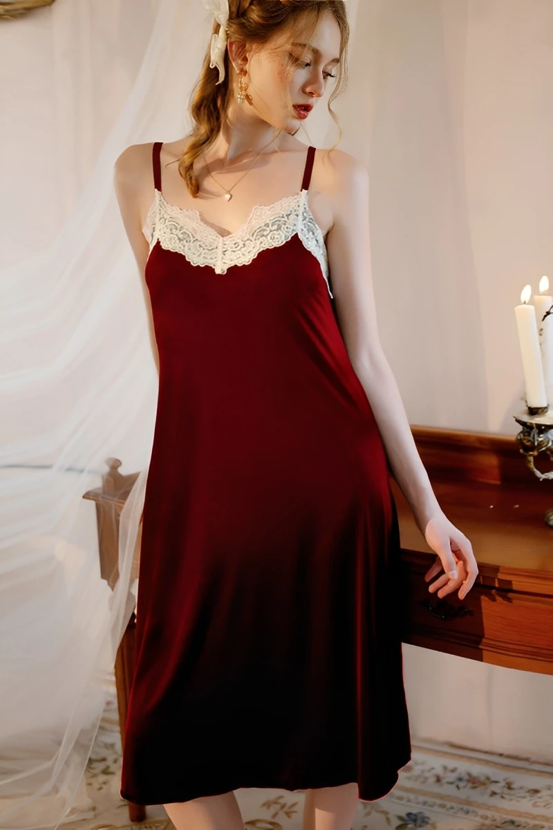 Model wearing a burgundy lace trim satin pajama set with lace-trimmed neckline and smooth satin fabric