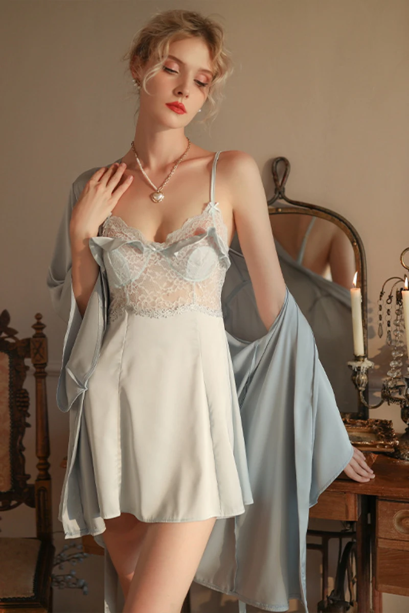 Model wearing a light blue satin nightdress with lace bodice and matching robe, presented as a b2b sexy nightgown for women