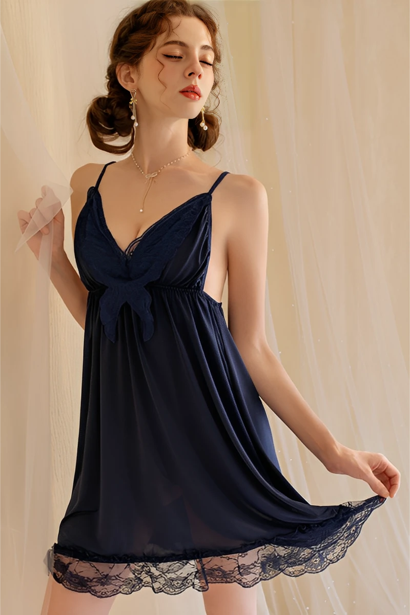 Model posing in navy blue lace sexy pajamas featuring a soft flowing skirt, lace hem, and elegant lingerie styling