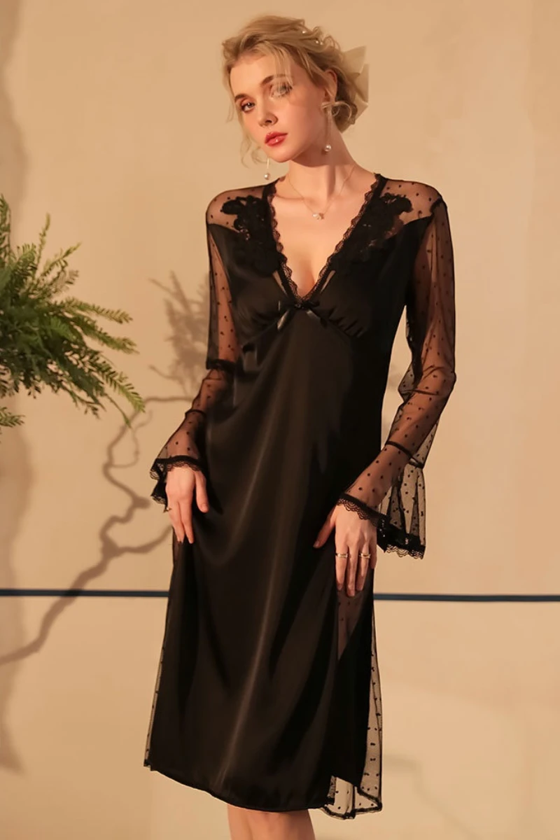 Model in nightgowns sexy black lace nightdress featuring sheer sleeves, deep V-neck, and flowing hemline