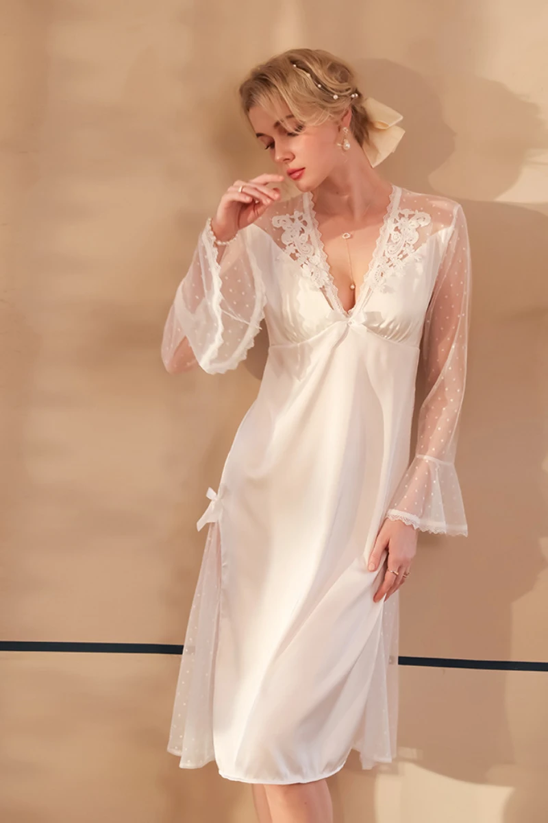 Woman wearing nightgowns sexy white lace nightdress with sheer sleeves, V-neckline, and flowing skirt